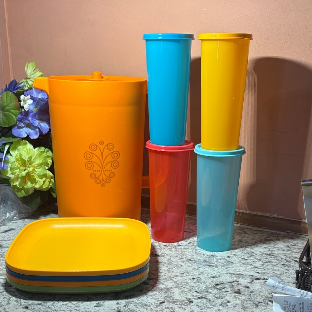 Tupperware Orange Pitcher with Multicolor Tumblers and Plates